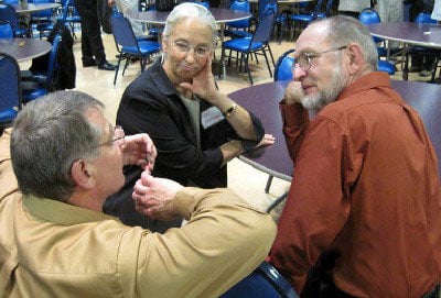 lancaster mennonite parents at an event table