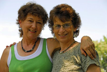 two women with arms around each other