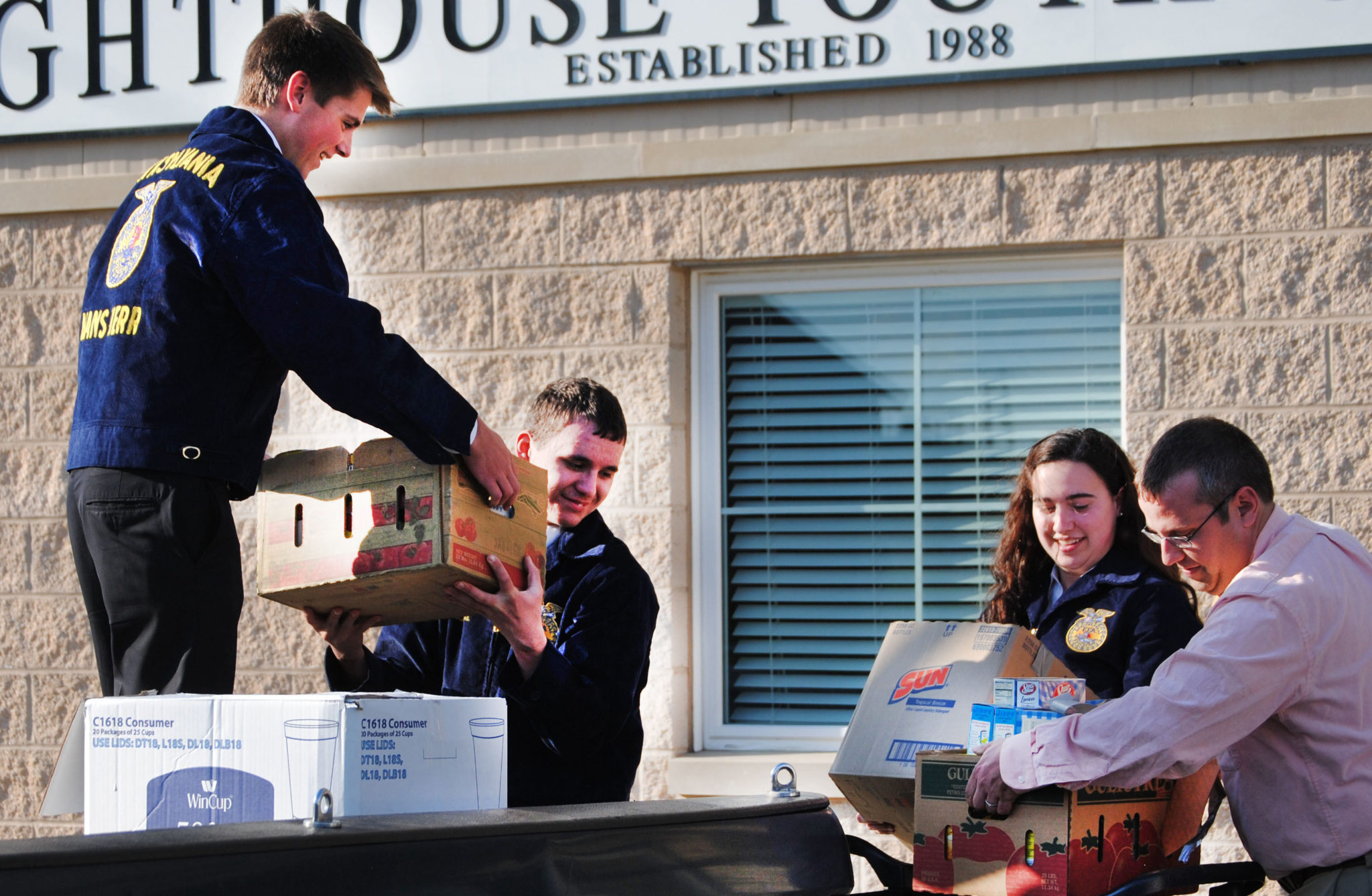 people carrying boxes