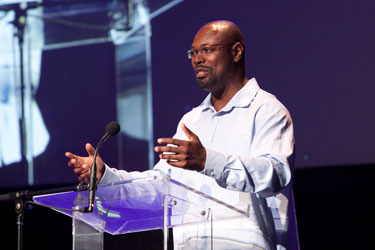 man speaking on stage