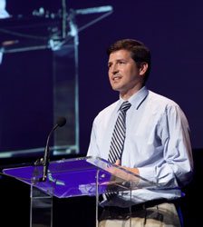 man speaking on stage