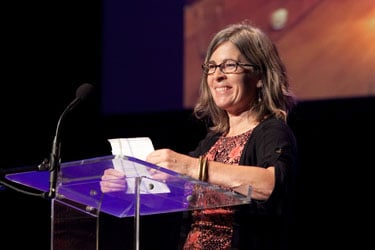 woman speaking at podium