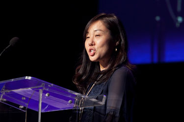 woman speaking at podium