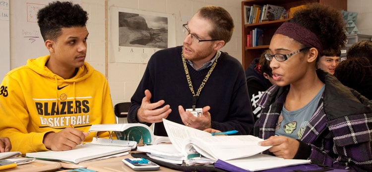 students talking with teacher