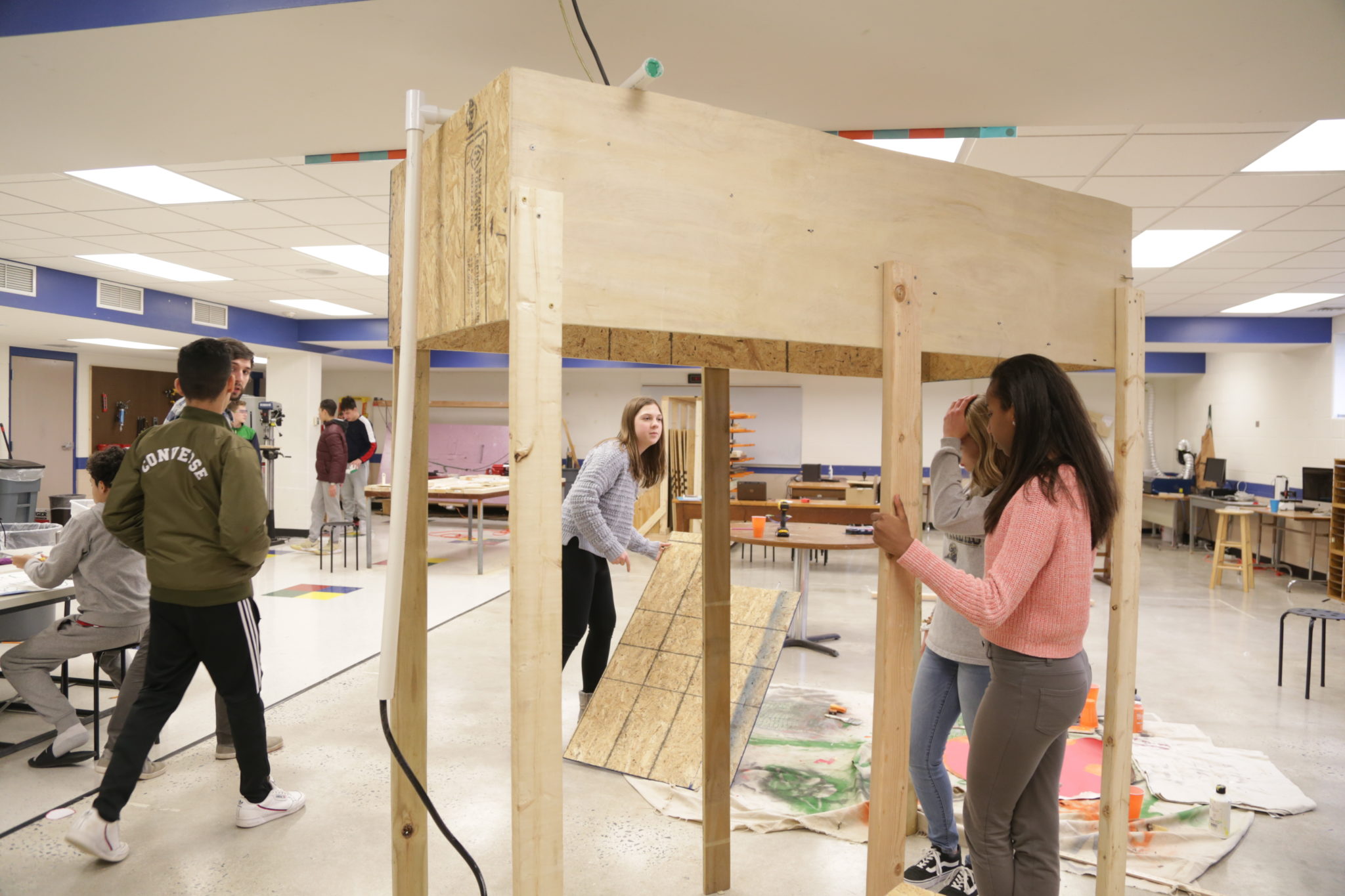 students building wooden structure