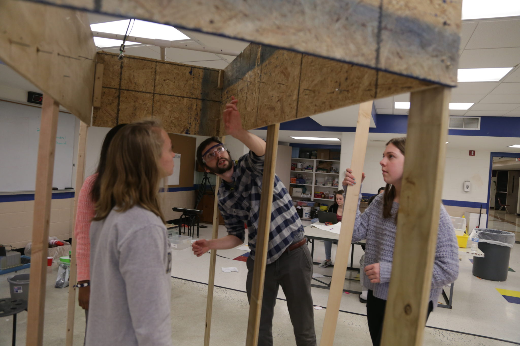 students building wooden structure