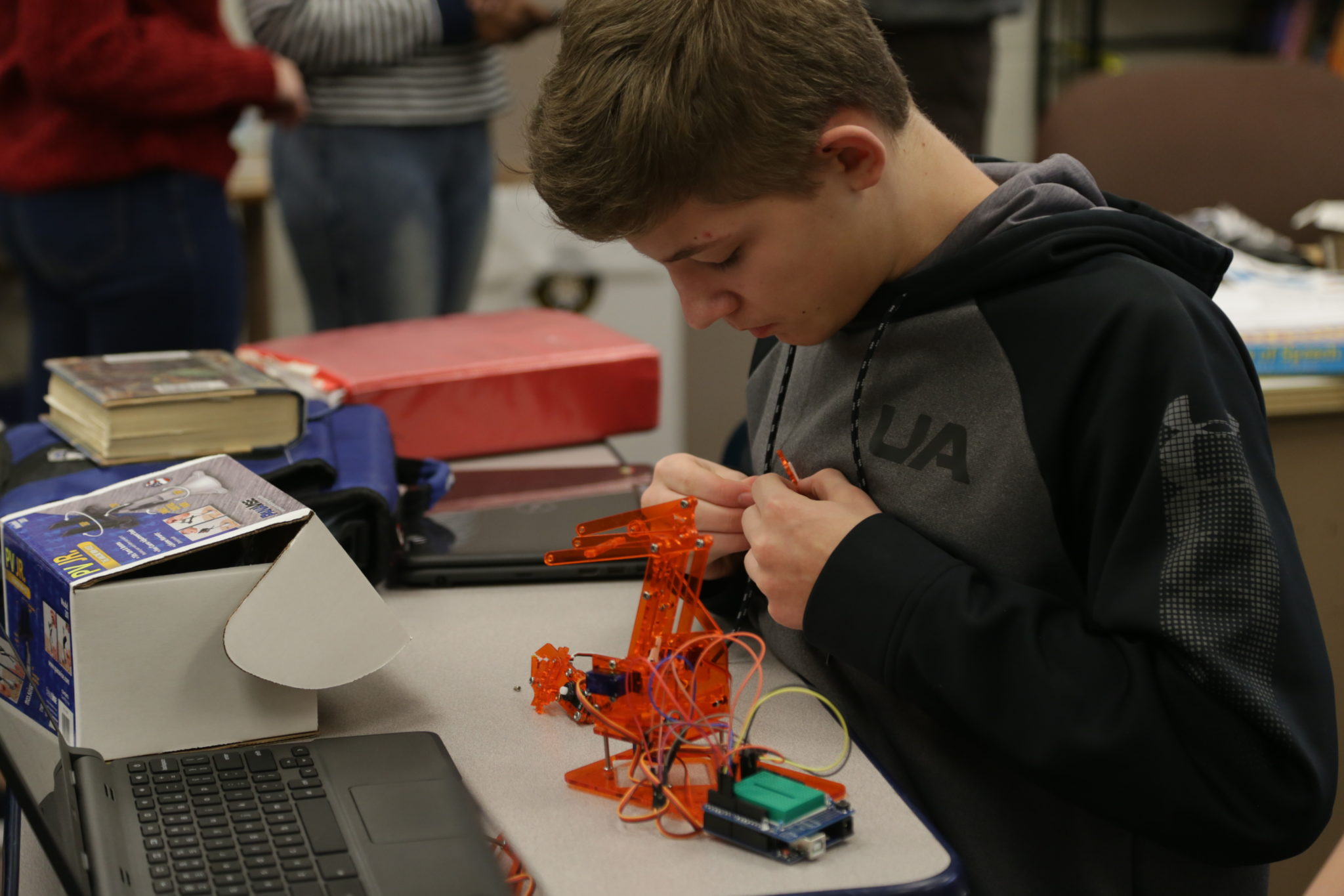 student working on robots