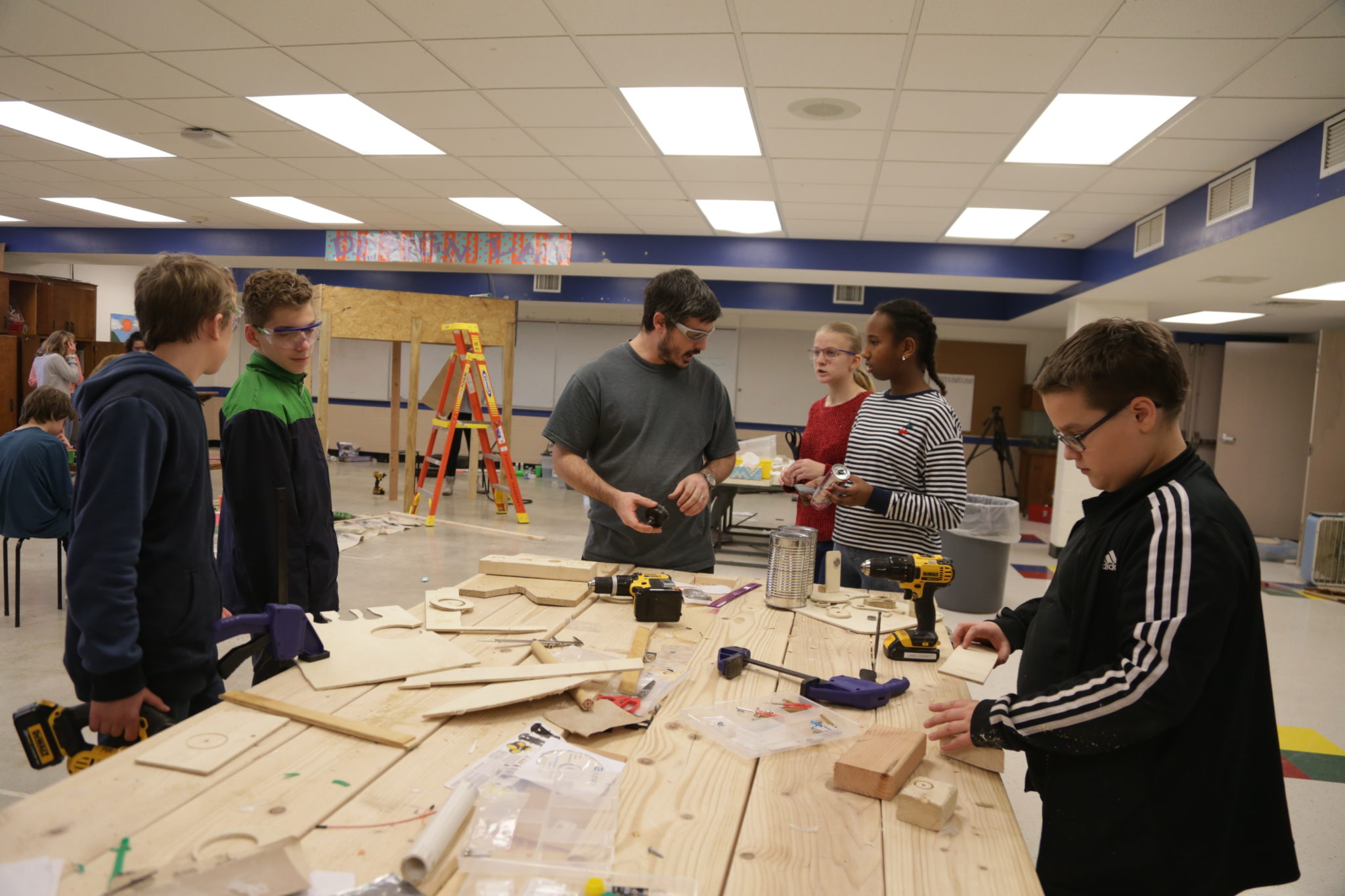 Students working on wood projects in steam class