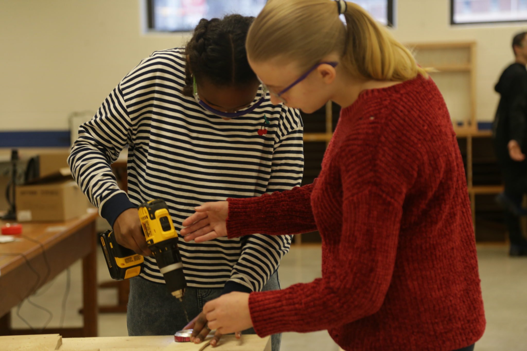 students using hand tools in shop class