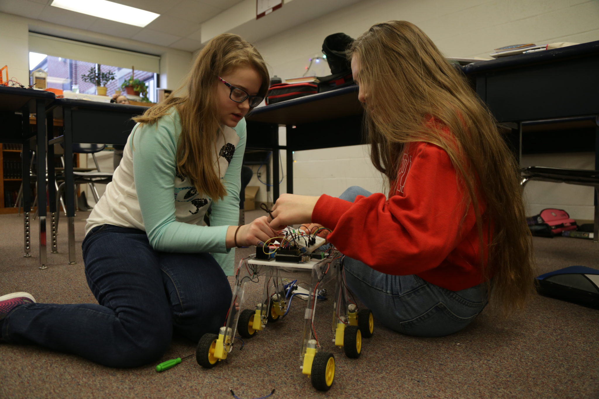 students working on robots