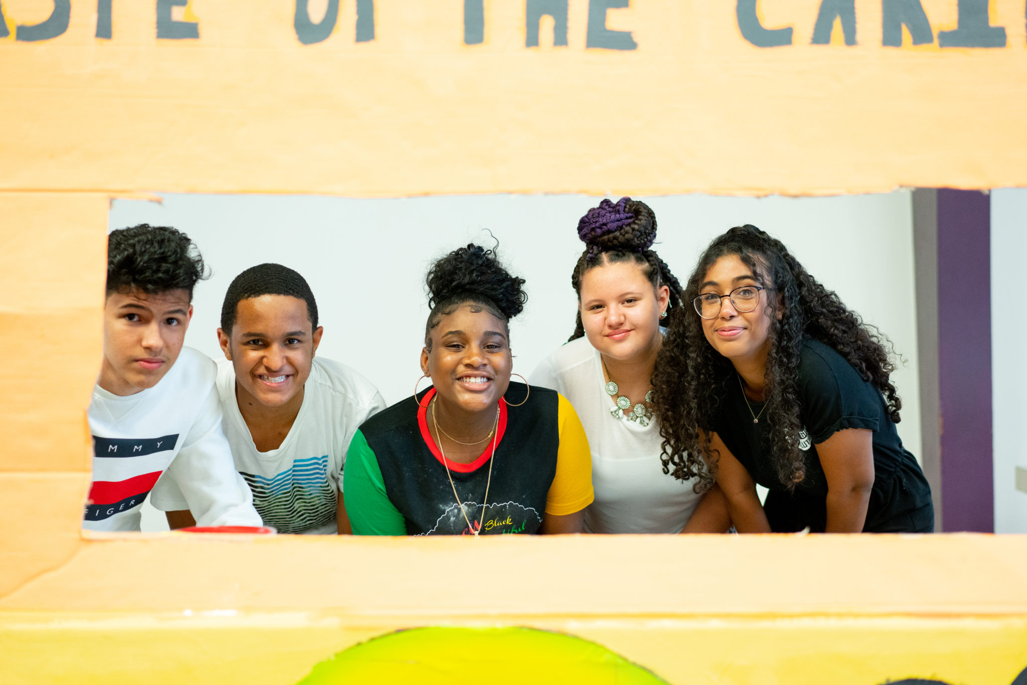 students posing with their food truck banners