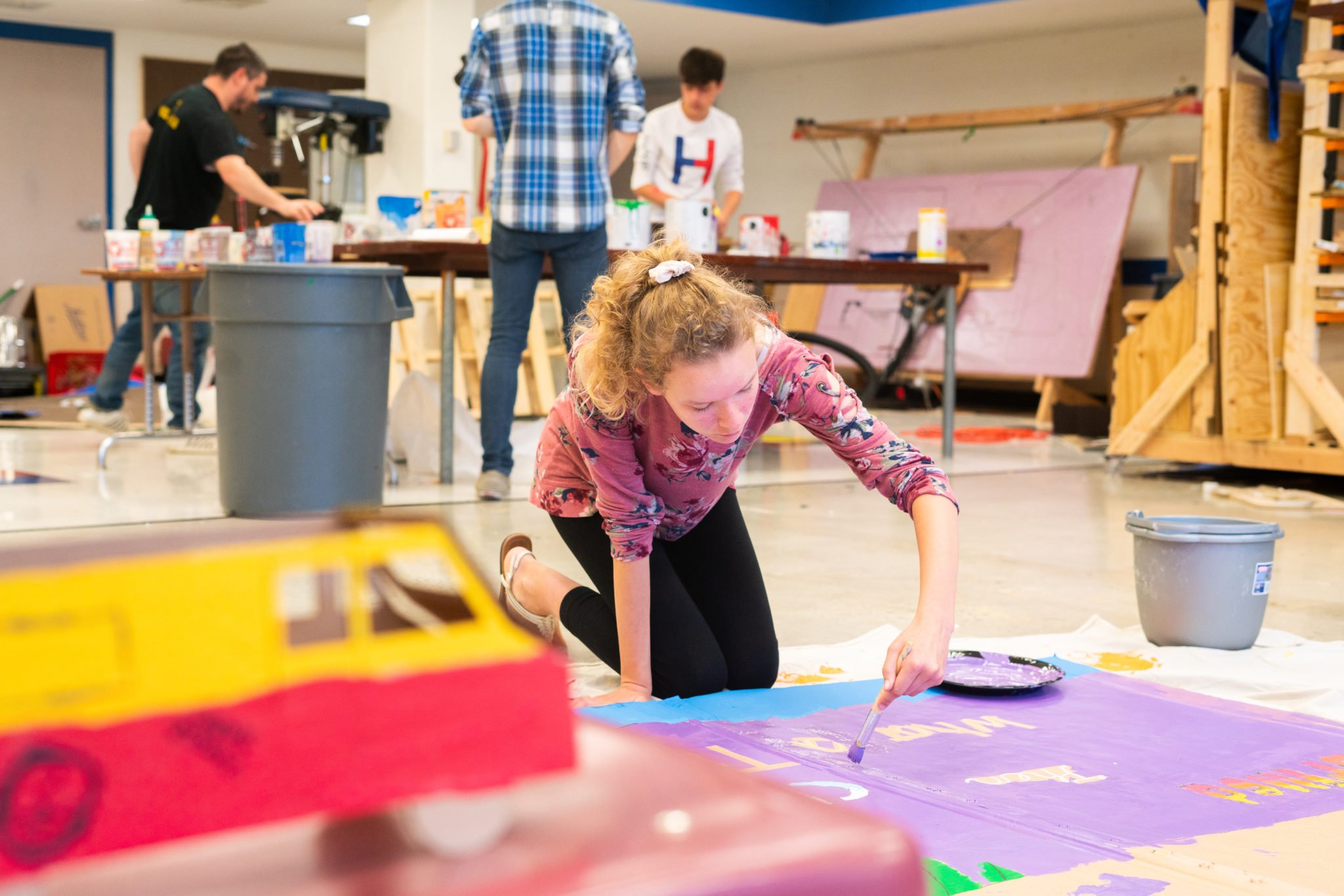 students working on banner paintings