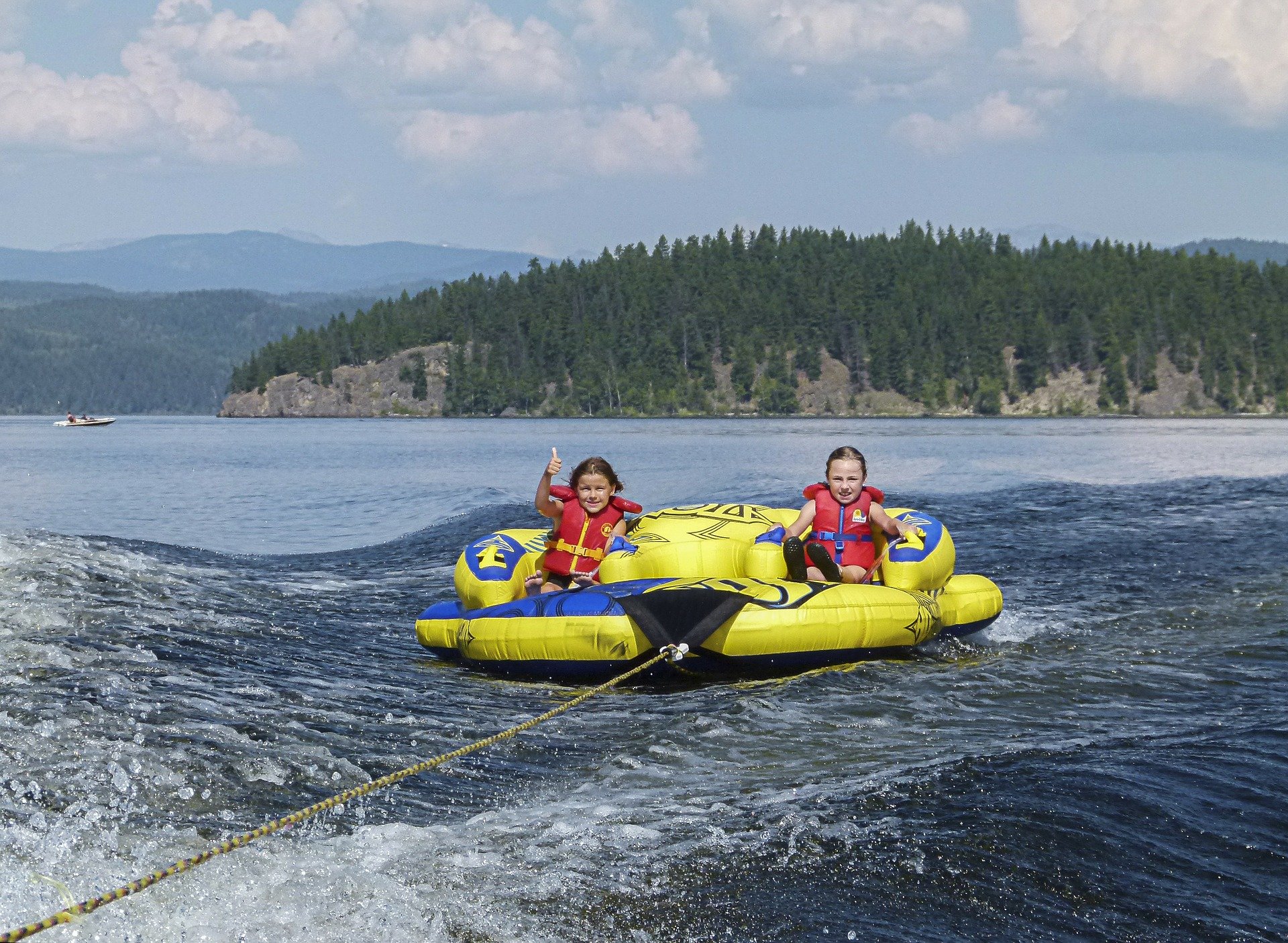 students on raft in lake