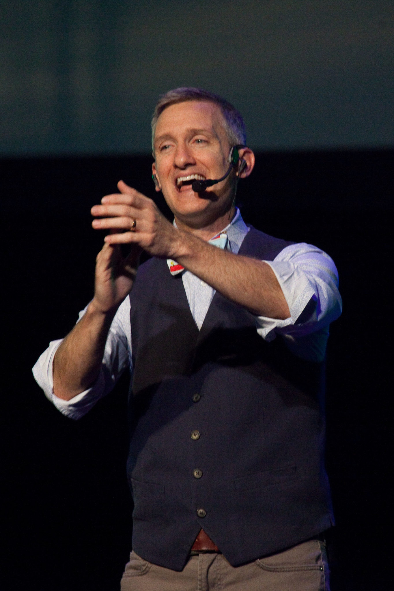 Man clapping hands speaking for chapel!