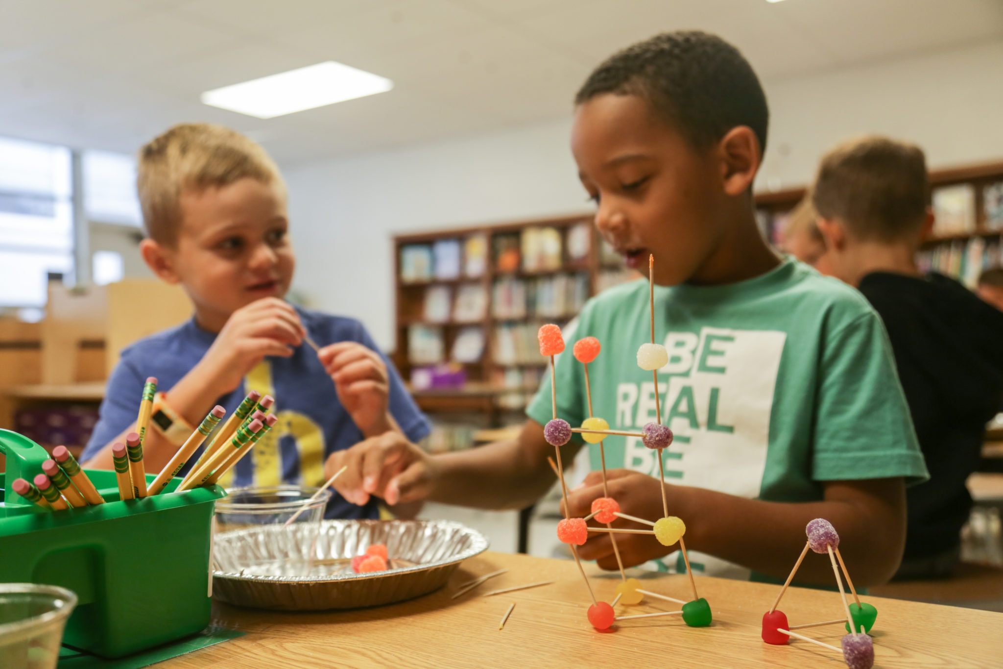 students building with tooth picks and candy