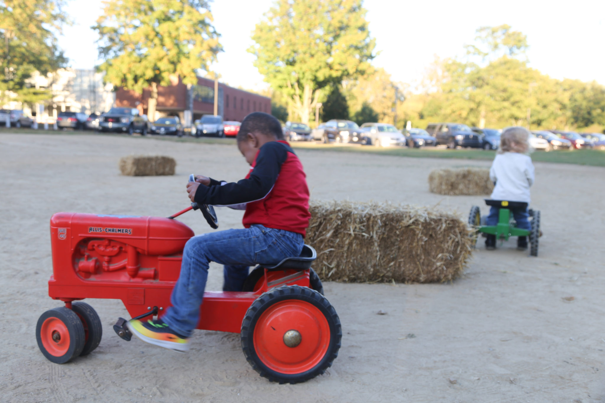 children on peddle tractors at homecoming 2019