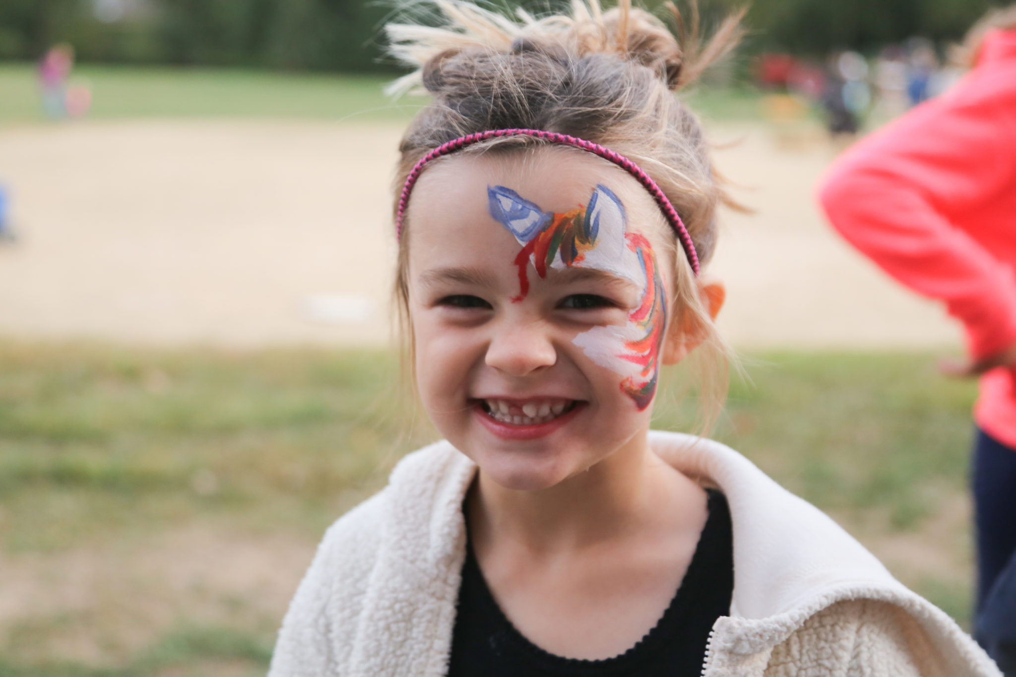 student with unicorn painted on face