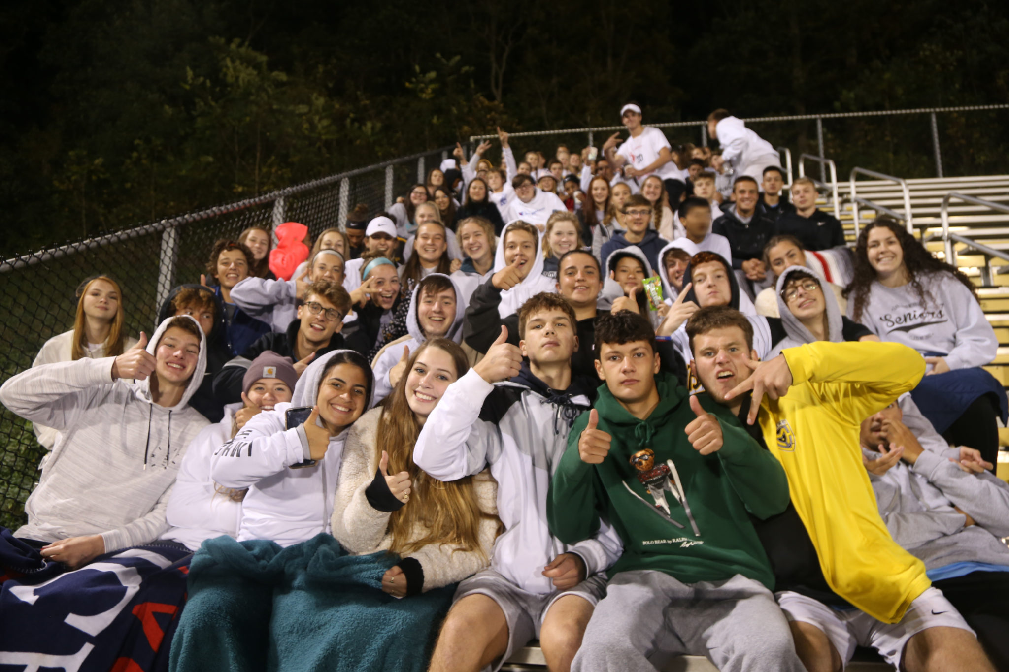 Students on bleachers during a game