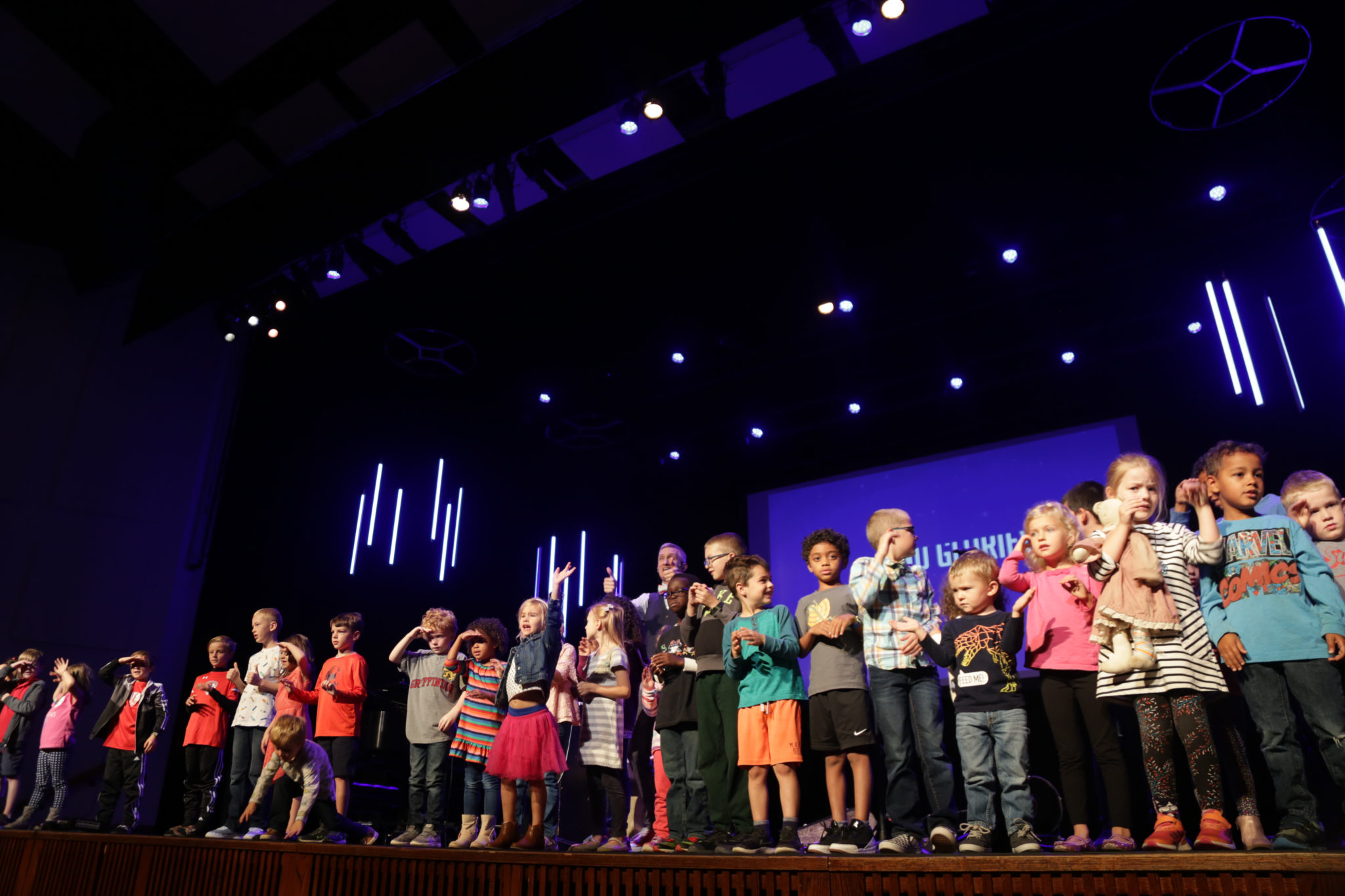 students performing on stage