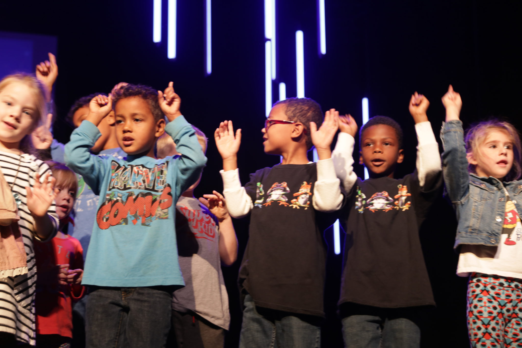 students performing on stage