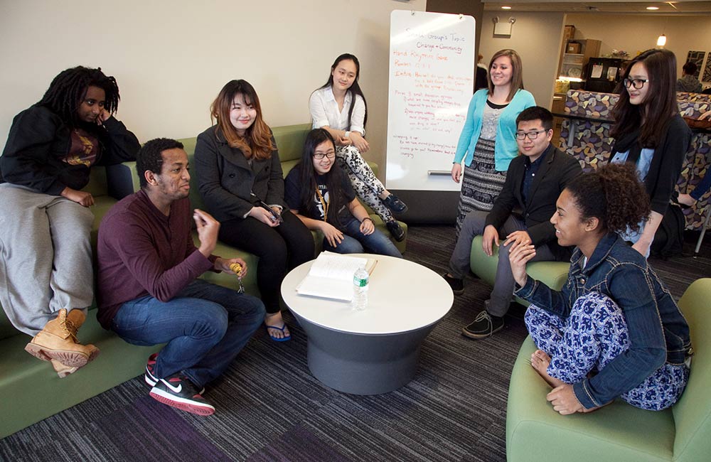 students conversing in dorm great hall