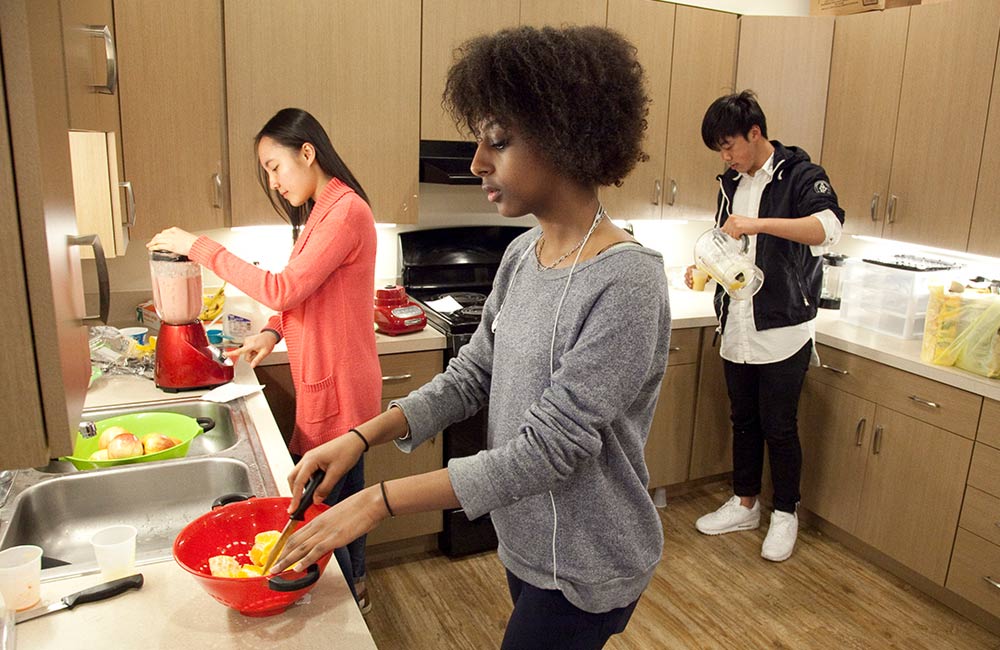 students cooking in dorm kitchen