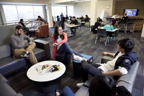 Students relaxing in millstream hall great room