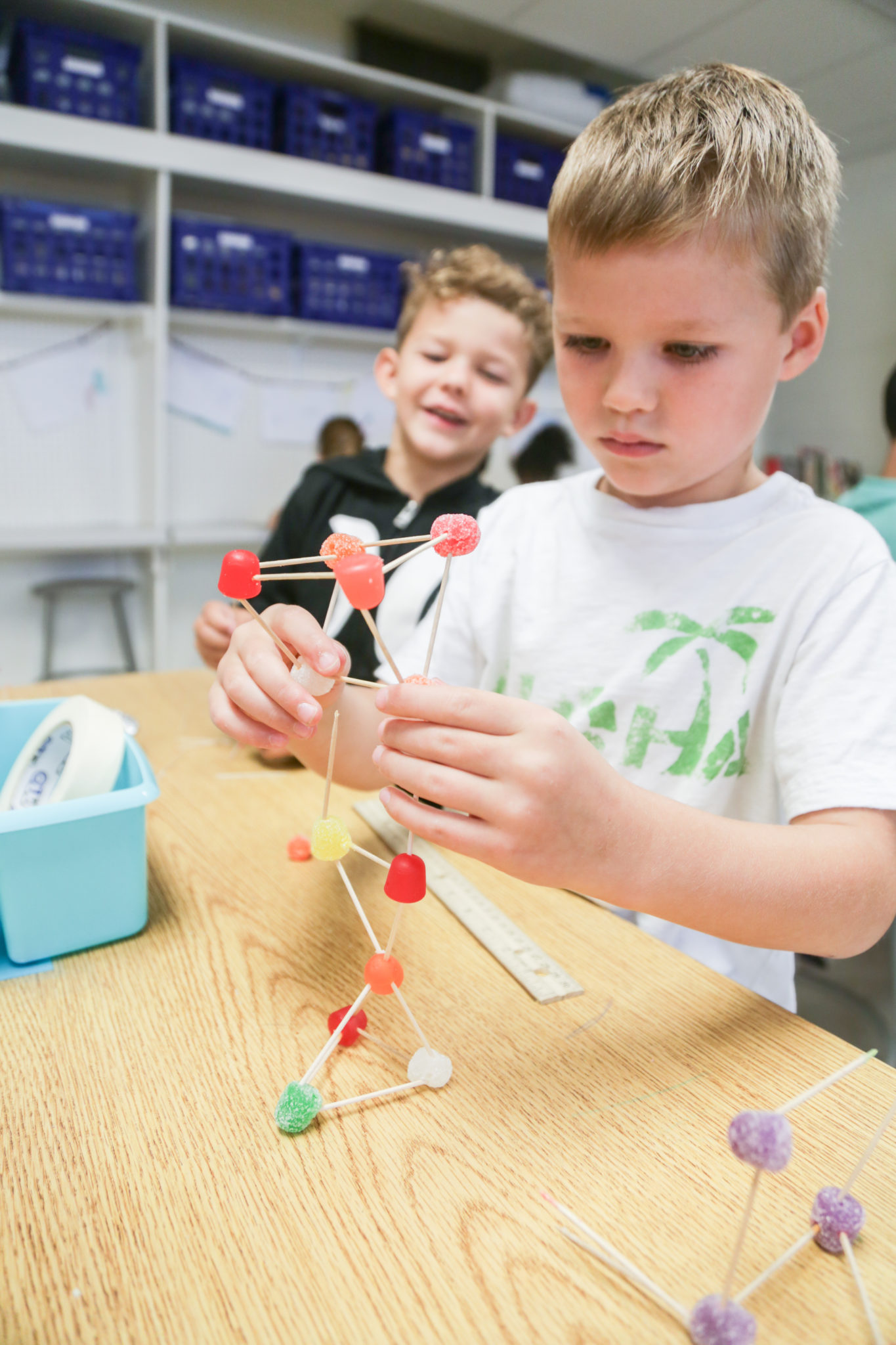 students building with tooth picks and candy