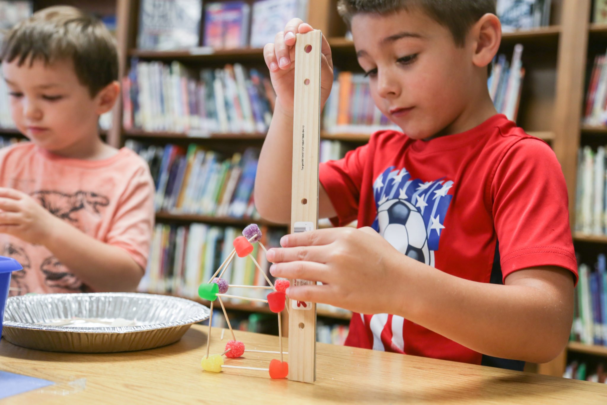 students building with tooth picks and candy