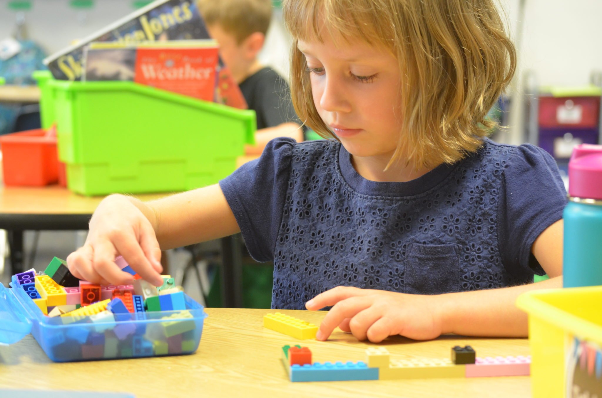 Student playing Legos