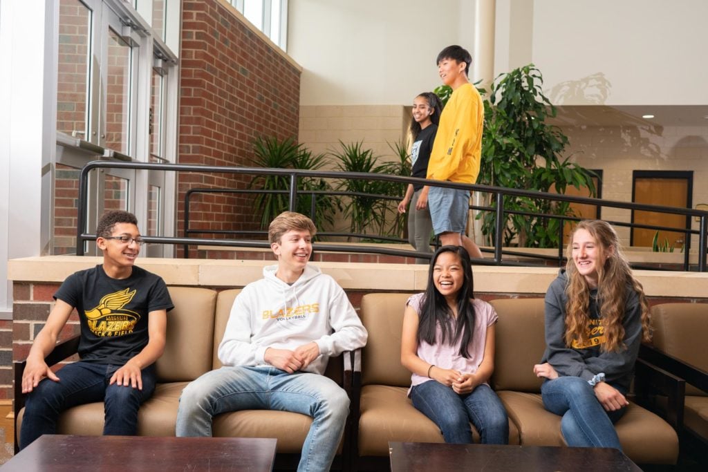 atrium with students smiling