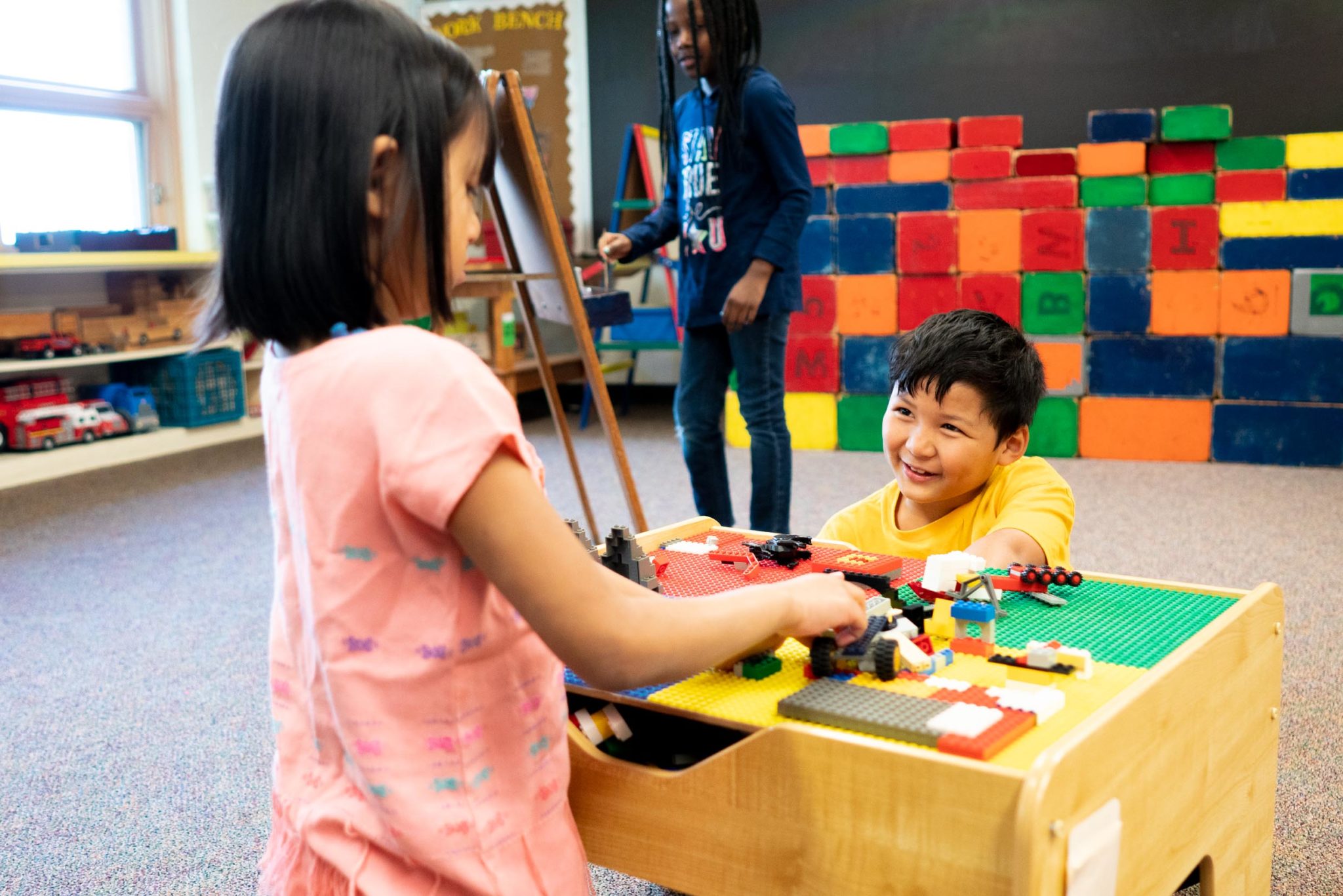 students playing with legos