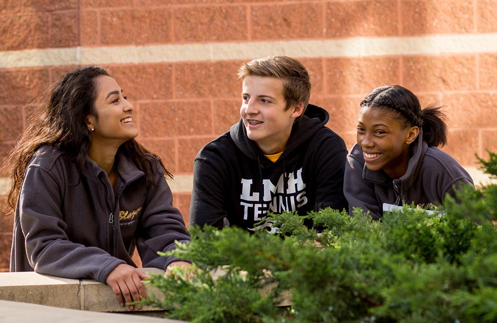 students on campus smiling