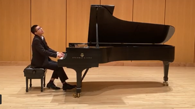 Student playing piano