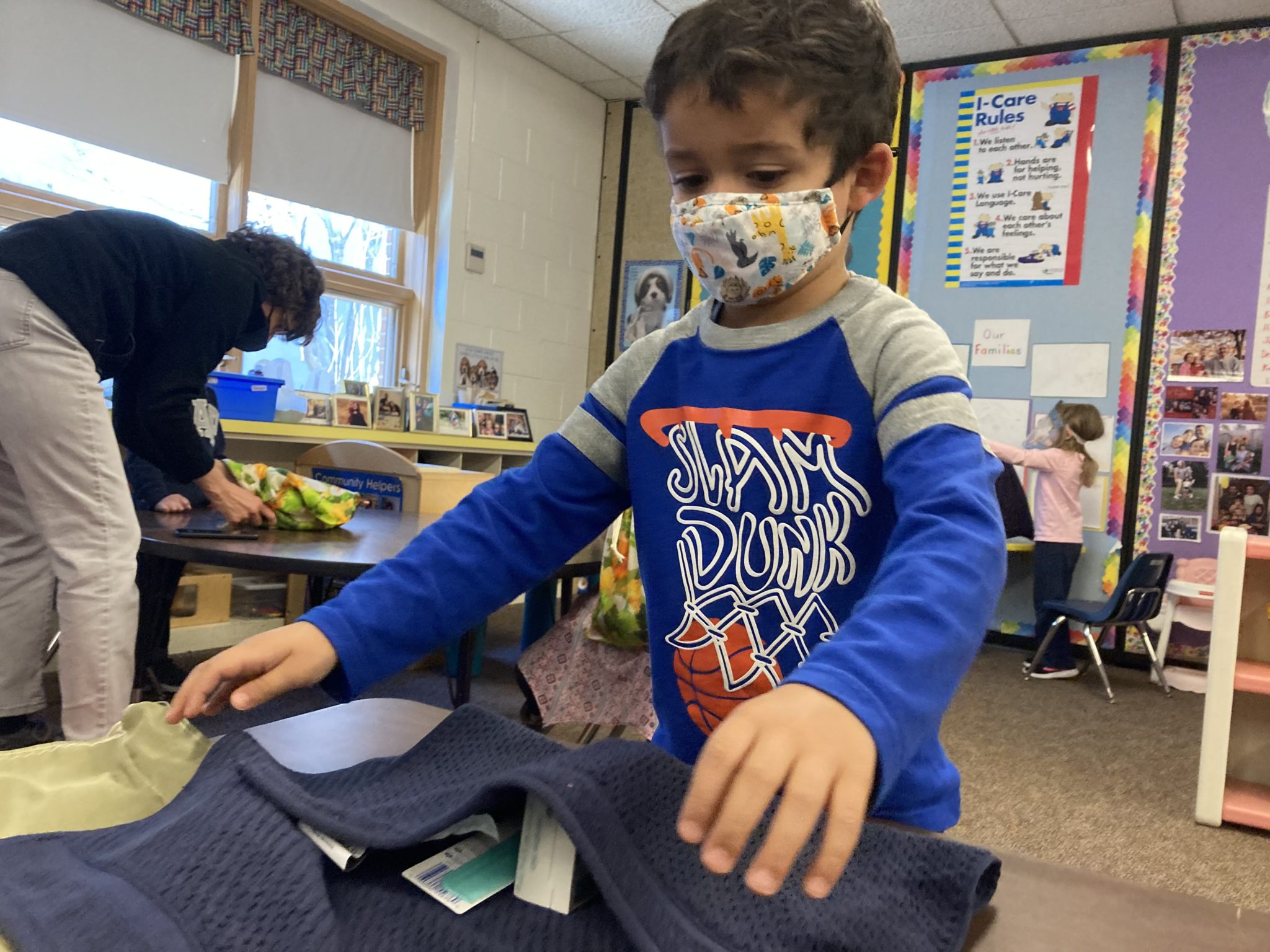 student folding towel