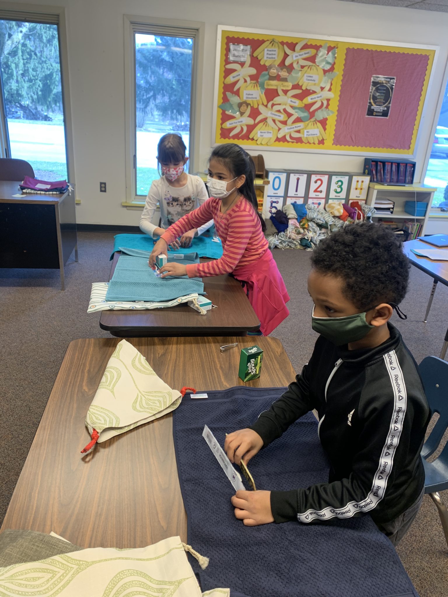 students folding towels