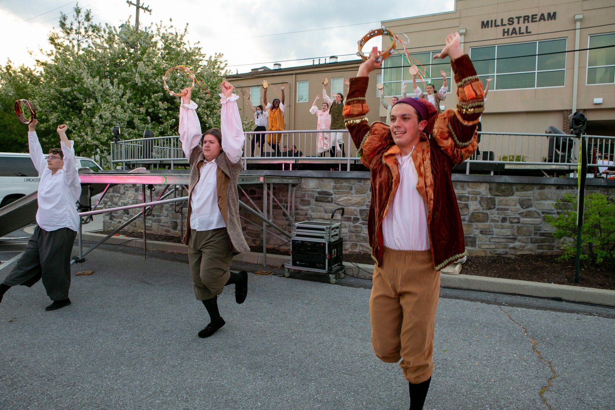 students dancing and acting during the performance of all the worlds a stage