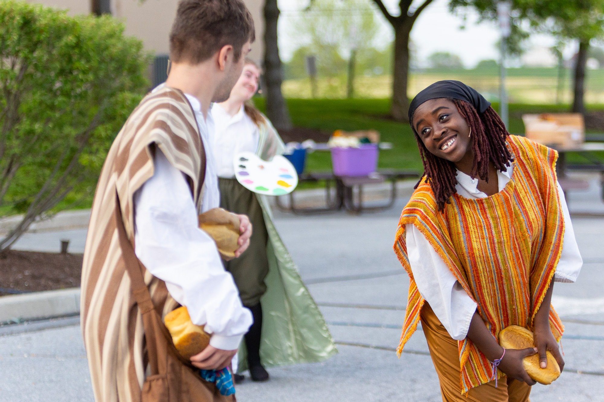 students acting during the performance of all the worlds a stage