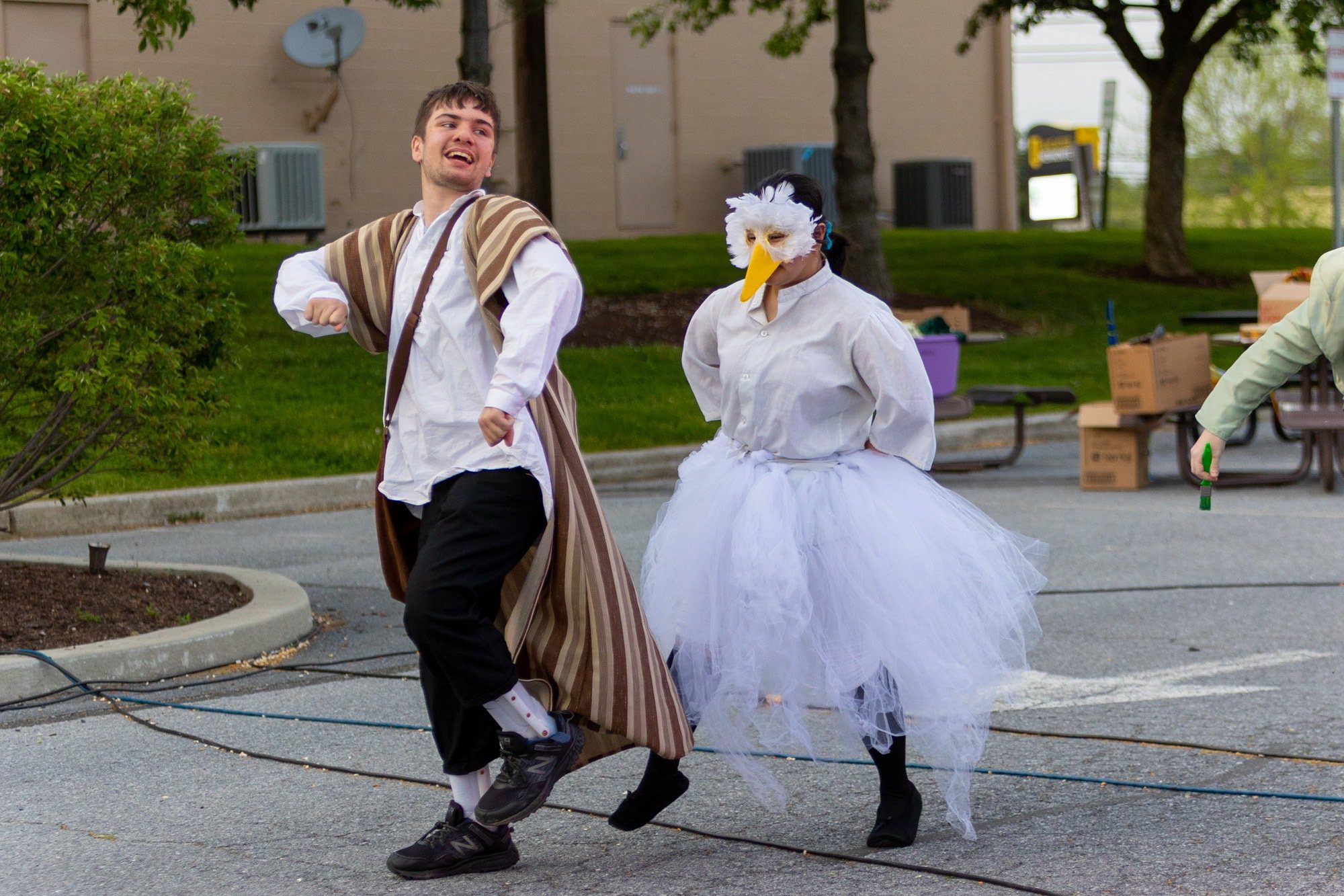 students acting during the performance of all the worlds a stage