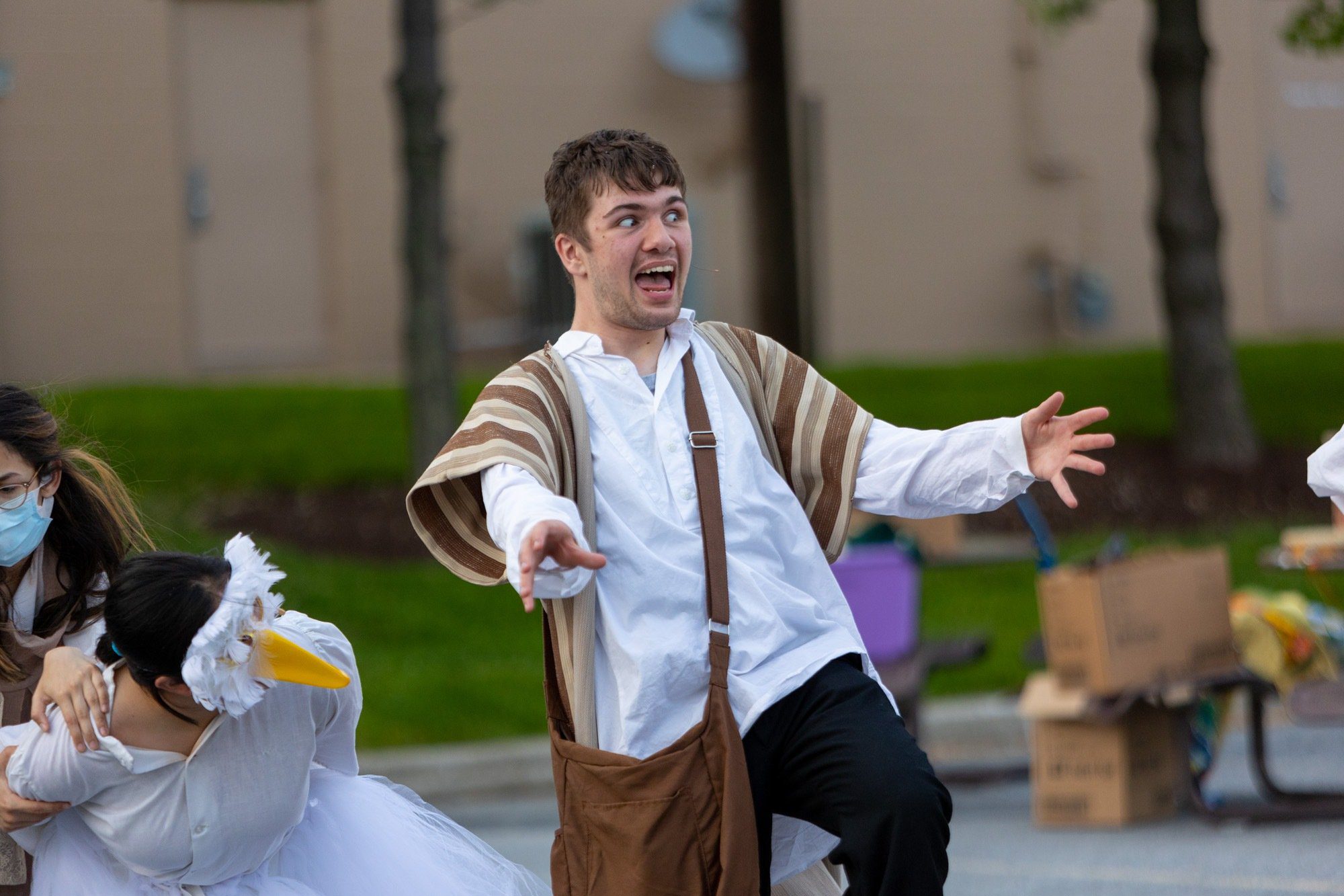 student acting during the performance of all the worlds a stage