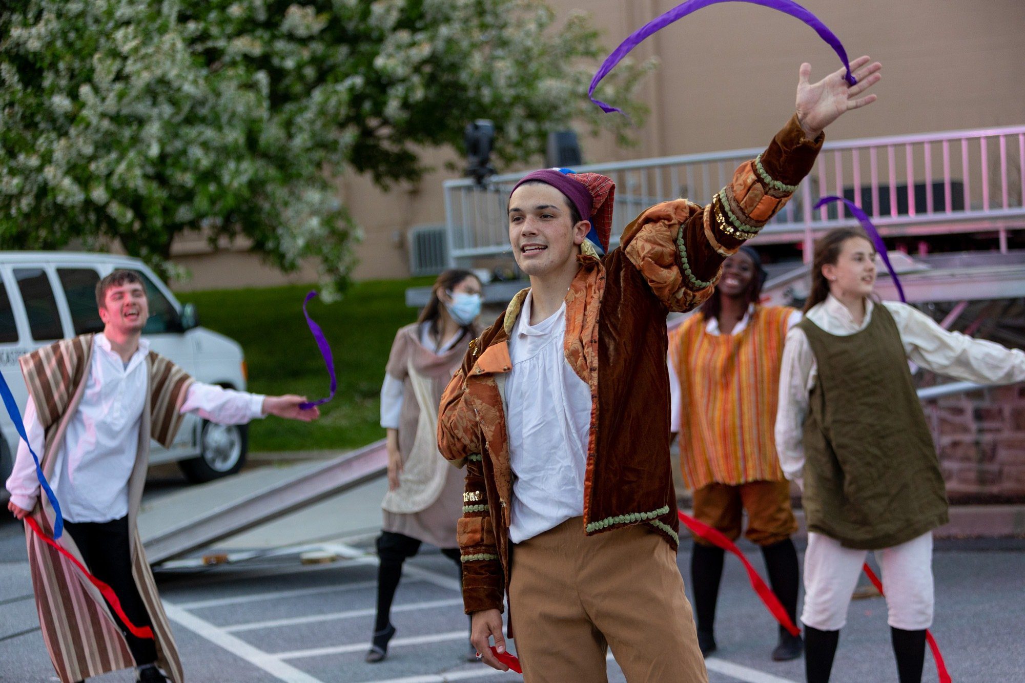 students dancing during the performance of all the worlds a stage