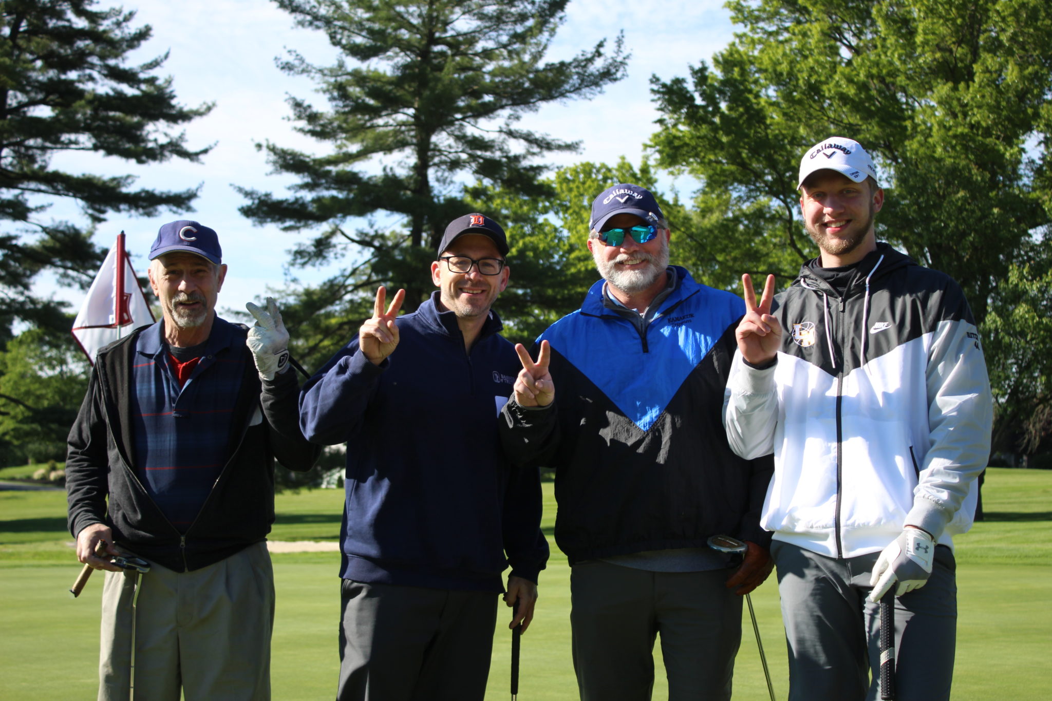 4 male golfers