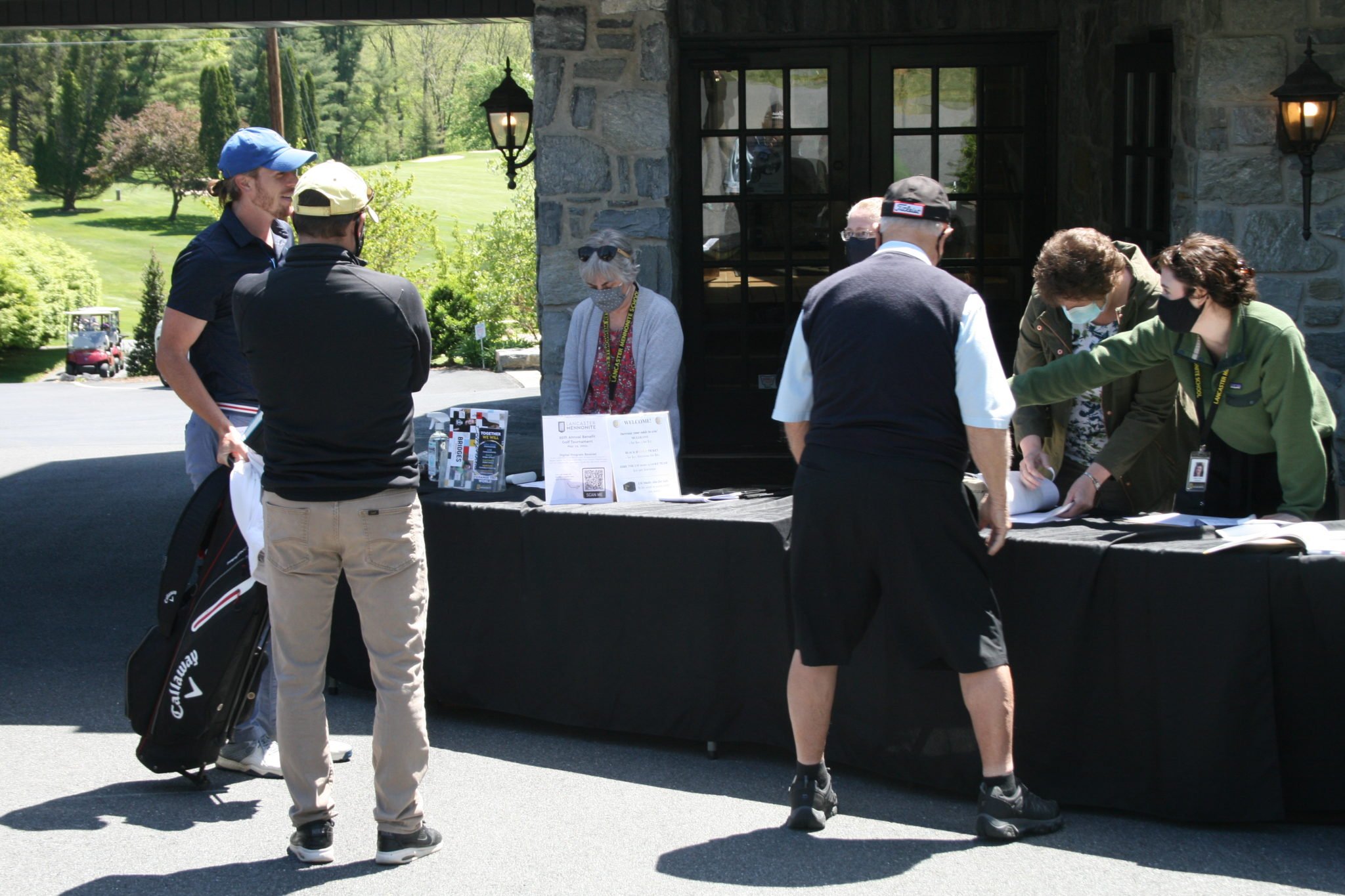 golfers at registration table