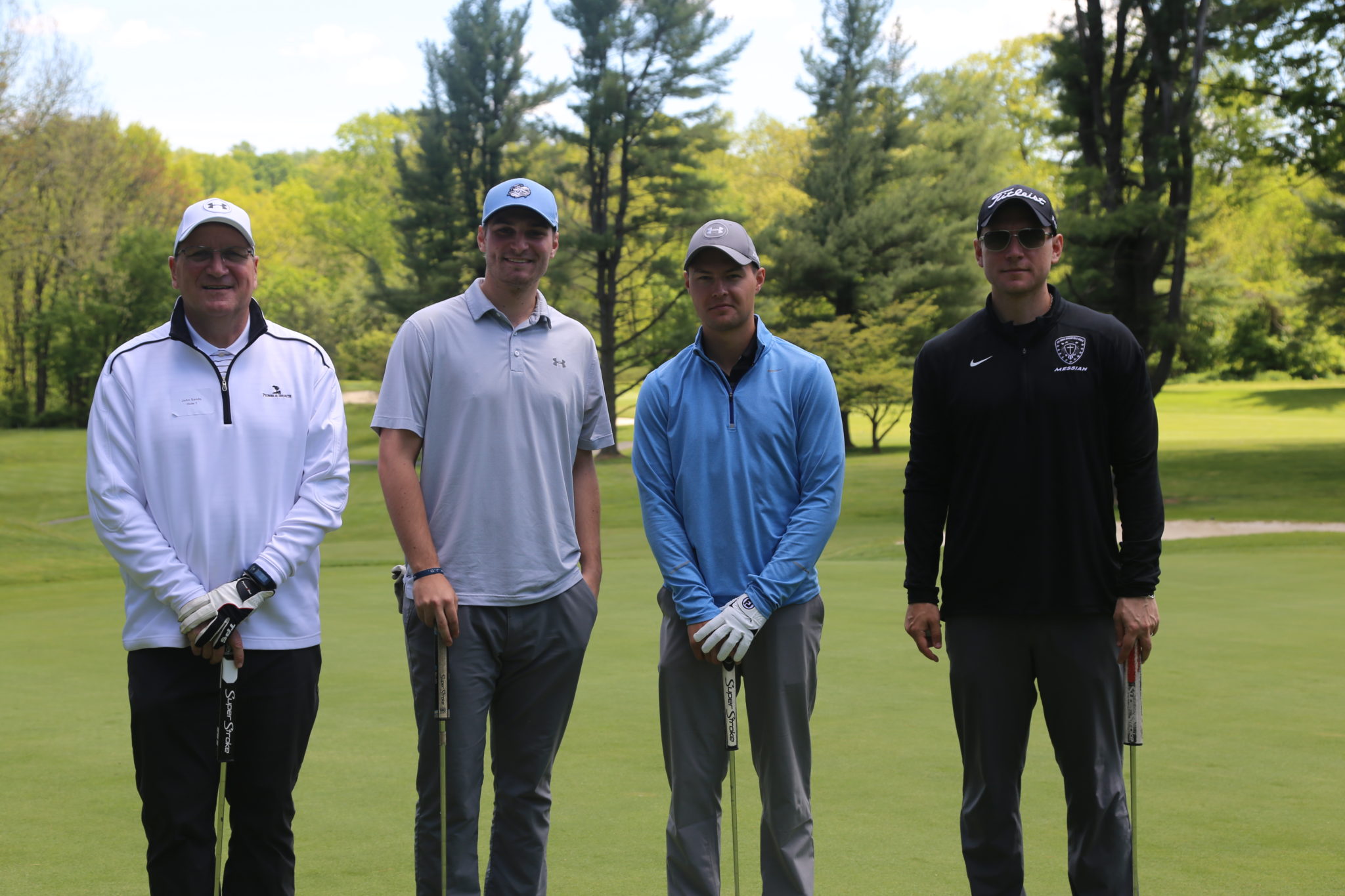 4 male golfers