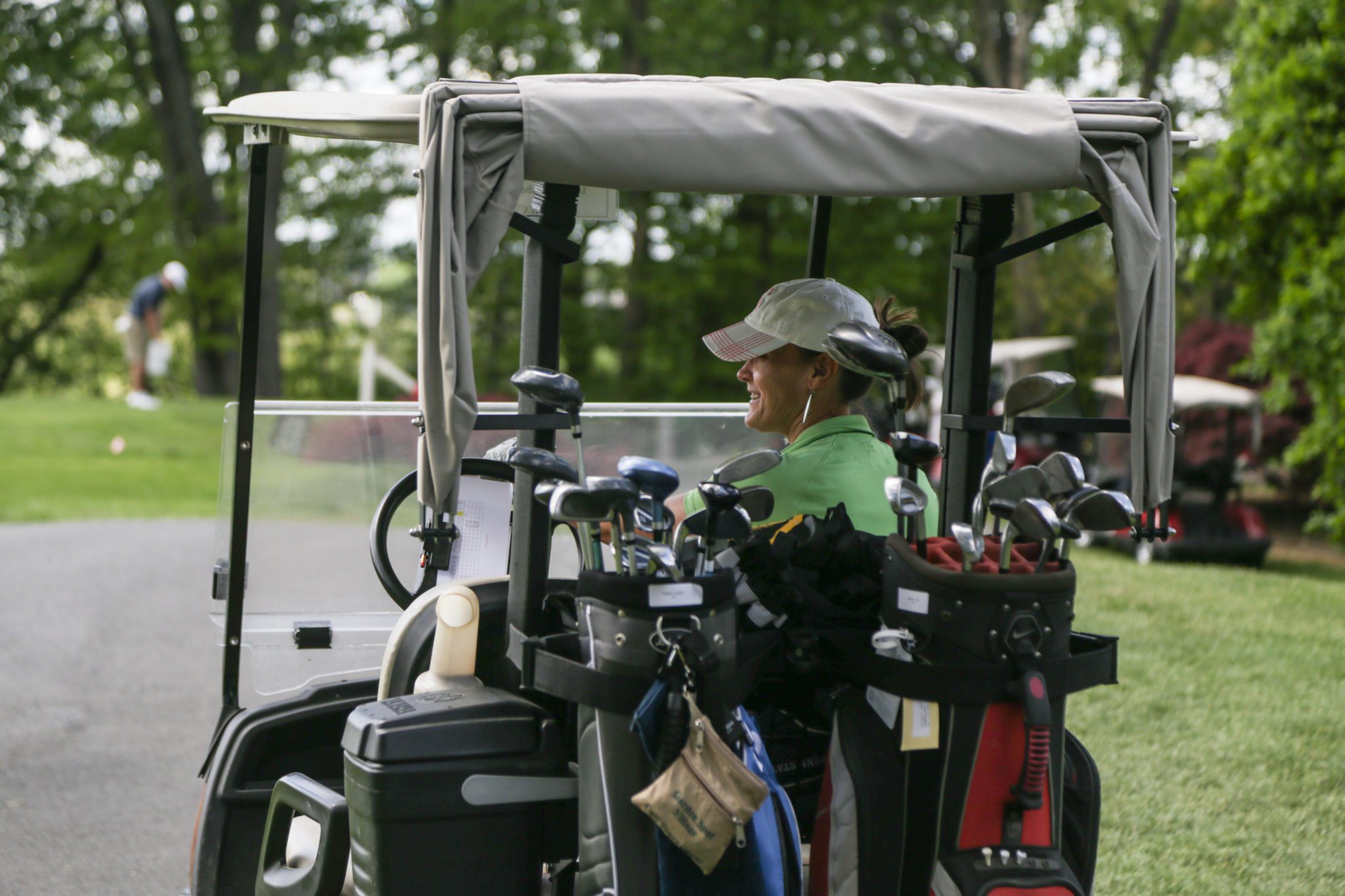 woman on golf cart