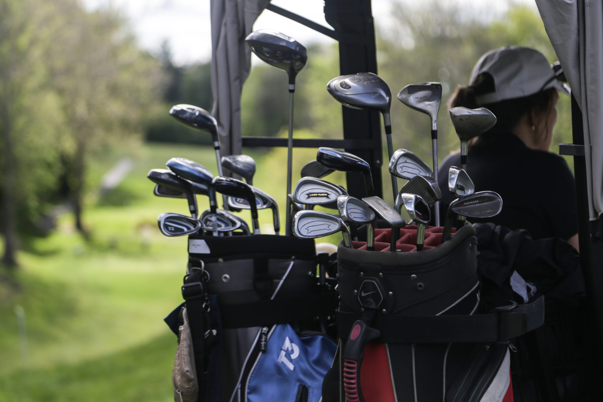 golf clubs on golf cart photo