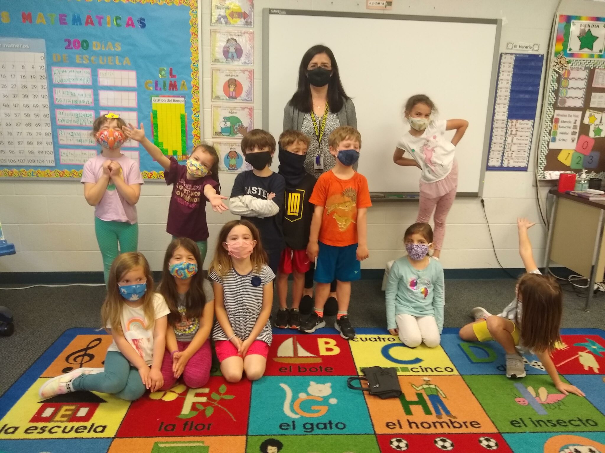 kids and teacher in kindergarten class