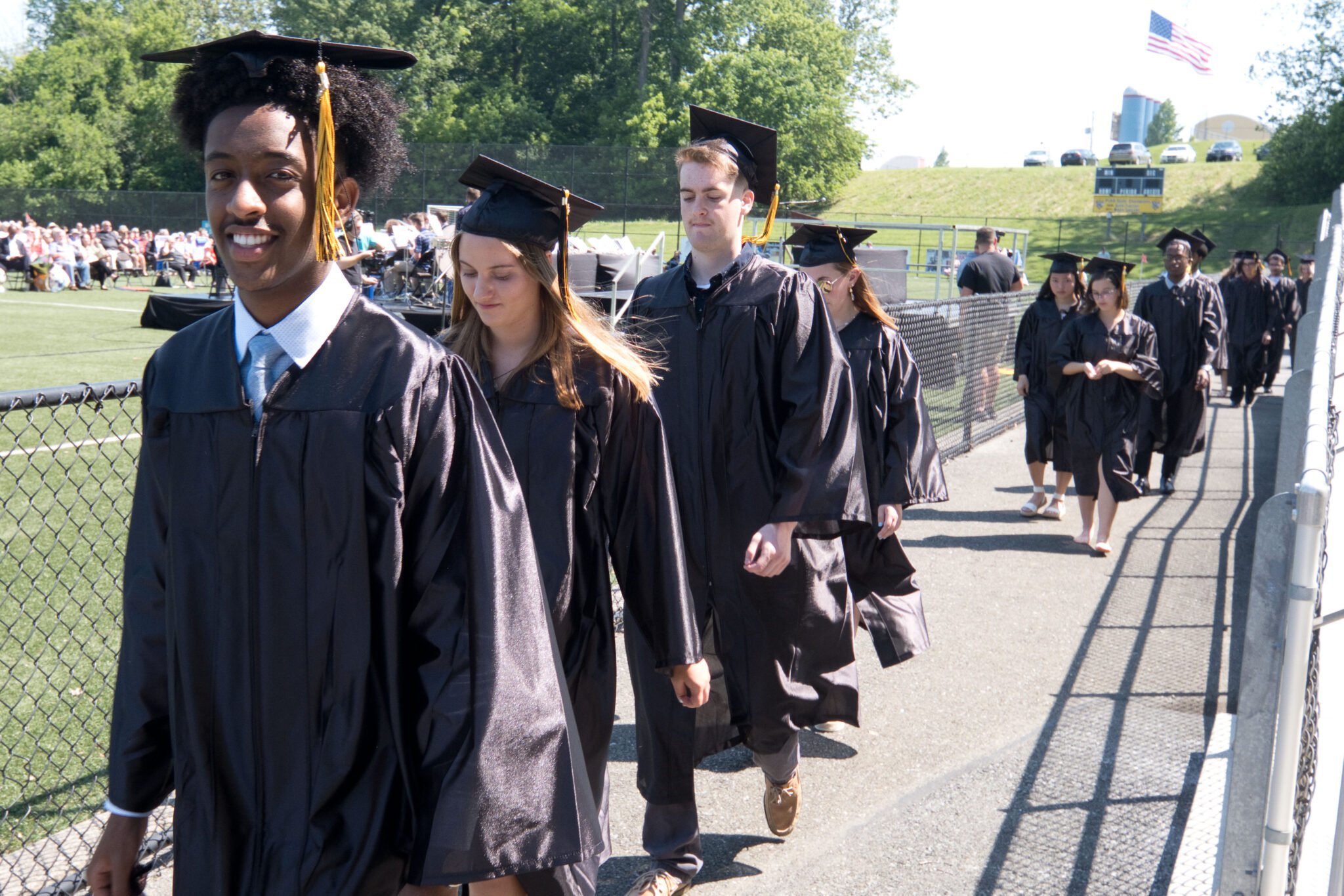 graduates walking into commencement