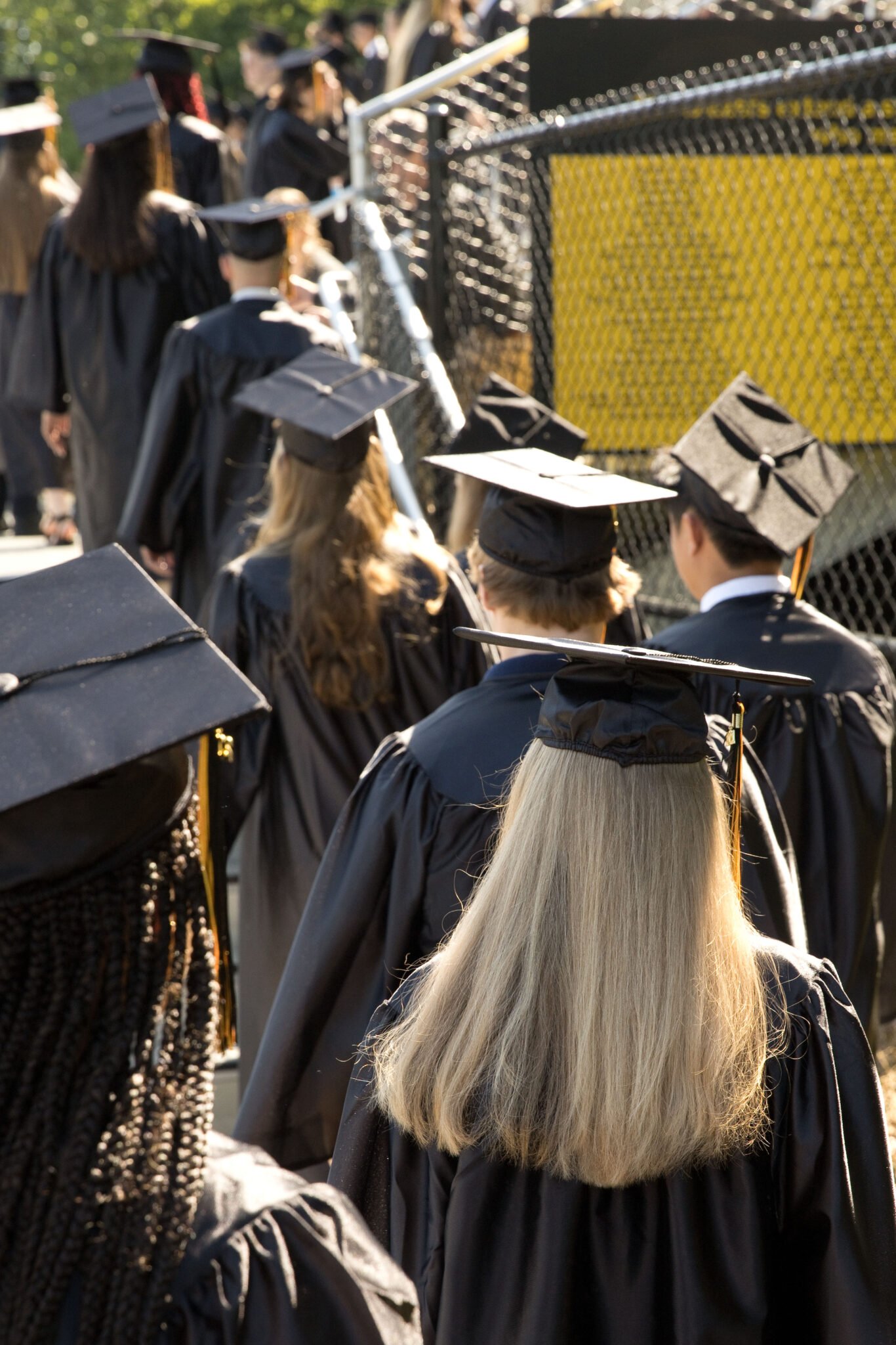 graduates walking into commencement