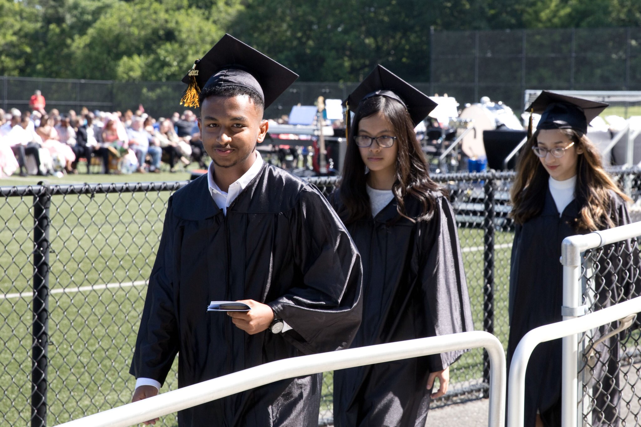 seniors walking into graduation service